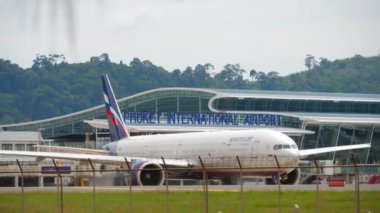 PHUKET, THAILAND - NOVEMBER 27, 2017: Boeing 777 of Aeroflot taxiing on taxiway at Phuket airport. Widebody board at the airport terminal. Tourism and travel concept