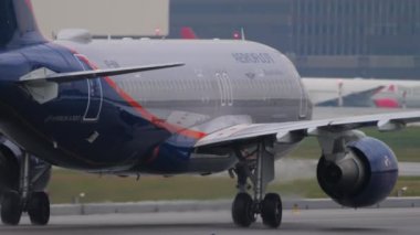 MOSCOW, RUSSIAN FEDERATION - JULY 28, 2021: Airbus A320 of Aeroflot on the taxiway, rear view. Tourism and travel concept