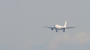SOCHI, RUSSIA - AUGUST 02, 2022: Airbus A330 iFly airline approaching to land at Sochi airport. Airliner landing gear release and ready for landing