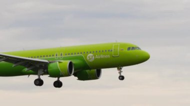 NOVOSIBIRSK, RUSSIAN FEDERATION - JULY 15, 2022: Airbus A320, RA-73453 of S7 Airlines landing at Tolmachevo airport, side view. Footage of a passenger plane arriving. Tourism and travel concept