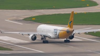SOCHI, RUSSIA - AUGUST 02, 2022: Airbus A330 of iFly on the runway speed up before takeoff, rear view. Airplane on the airfield, departure. Tourism and travel concept
