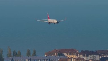 SOCHI, RUSSIA - JULY 29, 2022: Commercial plane boeing 737 of Nordwind landing at Sochi airport. Tourism and travel concept