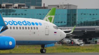 NOVOSIBIRSK, RUSSIAN FEDERATION - JULY 15, 2022: Boeing 737 of Pobeda taxiing on the runway at Tolmachevo airport. Lowcost airline on the runway. Airliner on the airfield. Tourism and travel concept