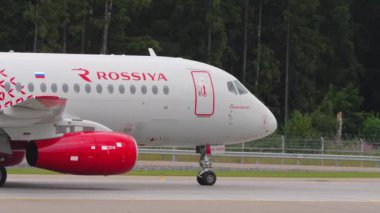 MOSCOW, RUSSIAN FEDERATION - JULY 28, 2021: Sukhoi Superjet 100-95B, RA-89014 of Rossiya taxiing at Sheremetyevo Airport SVO. Tourism and travel concept. Airplane on the taxiway
