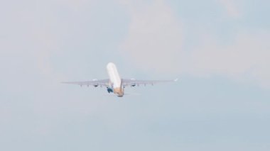 SOCHI, RUSSIA - AUGUST 02, 2022: Airbus A330 iFly takeoff and climb-up, rear view. Tourism and travel concept