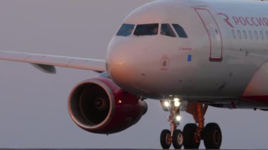 KAZAN, RUSSIA - AUGUST 05, 2022: Airbus A320 of Rossiya Airlines takeoff at sunset in Kazan airport. Commercial passenger aircraft speed up on the runway. Flight departing