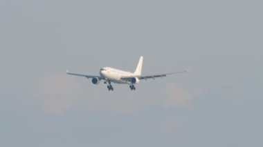 SOCHI, RUSSIA - AUGUST 02, 2022: Airbus A330 of iFly airline approaching to land at Sochi airport. Airliner landing gear release and ready for landing