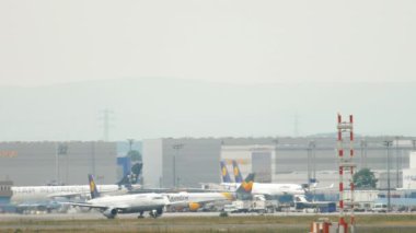 FRANKFURT AM MAIN, GERMANY - JULY 17, 2017: Lufthansa Airbus A321 take-off at runway 07C. Side view, passenger plane departure and climb. Fraport, Frankfurt, Germany