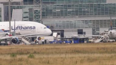 FRANKFURT AM MAIN, GERMANY - JULY 17, 2017: Widebody passenger airliner Lufthansa taxiing at Frankfurt airport, side view. Tourism and travel concept. Aircraft on apron