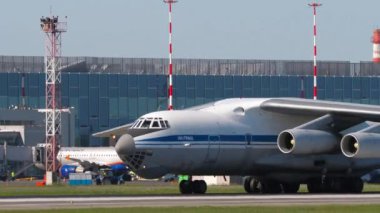NOVOSIBIRSK, RUSSIAN FEDERATION - JUNY 12, 2022: Transport aircraft of IL 76 taxiing at Tolmachevo airport. Il-76 Soviet military transport aircraft