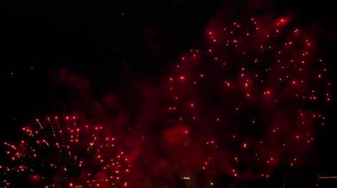 Festive fireworks in the sky are scattered with colorful lights. New Year and Christmas concept. Celebrating an event in the city