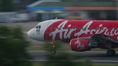PHUKET, THAILAND - NOVEMBER 26, 2016: Asian low-cost airline Airbus A320 AirAsia takeoff at Phuket airport. Airliner flies away. Tourism and travel concept