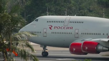 PHUKET, THAILAND - NOVEMBER 30, 2016: Boeing 747 of Rossiya speed up before departure, Phuket airport. View from the top floor of the hotel Centara Grand West Sands Resort Phuket