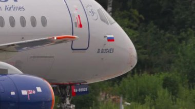 MOSCOW, RUSSIAN FEDERATION - JULY 28, 2021: Sukhoi Superjet 100-95B, RA-89028 of Aeroflot taxiing at Sheremetyevo airport. Civil aircraft on the taxiway. Tourism and travel concept