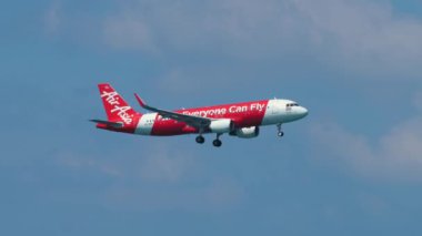 PHUKET, THAILAND - NOVEMBER 30, 2016: Airbus A320-216, HS-BBP of AirAsia landing at Phuket International Airport, Thailand. Tourism and travel concept