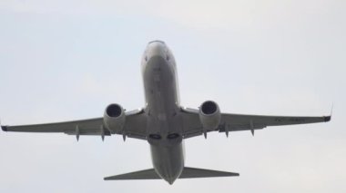 DUSSELDORF, GERMANY - JULY 23, 2017: Passenger plane boeing 737, TC-SNG of SunExpress flies overhead at Dusseldorf Airport. Airplane fly away