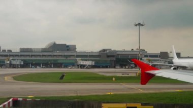 CHANGI, SINGAPORE - NOVEMBER 25, 2018: Passenger plane is ready to take off, first person view. Runway, Singapore Airport. Tourism and aviation concept