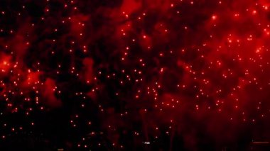 Festive fireworks in the night sky over the city. Holiday concept. Bright lights in honor of the holiday. New Years and Christmas