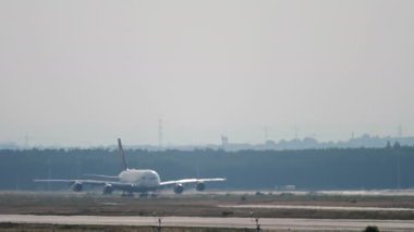 FRANKFURT AM MAIN, GERMANY - JULY 17, 2017: Airbus A380 of Lufthansa takeoff speed set, runway acceleration and departure at Frankfurt airport. Tourism and travel concept.