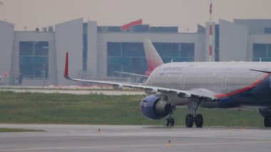 MOSCOW, RUSSIAN FEDERATION - JULY 28, 2021: Aeroflot plane taxiing to runway, departing flight at Sheremetyevo airport. Tourism and aviation concept