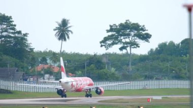 PHUKET, THAILAND - NOVEMBER 26, 2017: Airbus A320 of AirAsia takeoff at Phuket airport. Tourism and travel concept