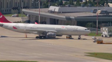 SOCHI, RUSSIA - JULY 29, 2022: Airbus A330, RA-73328 of Nordwind Airlines on the taxiway at Sochi airport. Tourism and air travel concept
