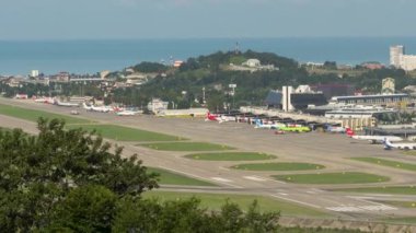 SOCHI, RUSSIA - JULY 29, 2022: Timelapse of airport traffic. Panoramic view of the airfield and aircraft