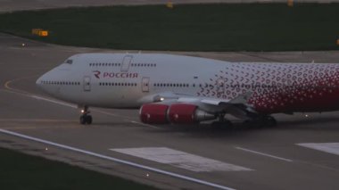SOCHI, RUSSIA - JULY 29, 2022: Boeing 747 Rossiya taxiing on runway at Sochi International Airport. Jumbo jet departure. Tourism and travel concept