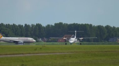 AMSTERDAM, THE NETHERLANDS - JULY 24, 2017: Airplane of FlyBe takeoff at Schiphol Airport, Amsterdam. Tourism and travel concept