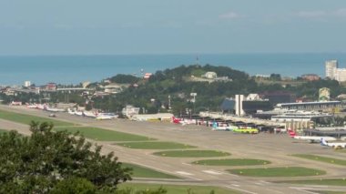 SOCHI, RUSSIA - JULY 29, 2022: Timelapse of airport traffic. Panoramic view of the airfield and aircraft