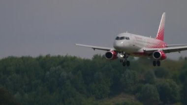MOSCOW, RUSSIAN FEDERATION - JULY 29, 2021: Jet plane of Rossiya landing, arrival at Sheremetyevo airport, side view. Tourism and travel concept