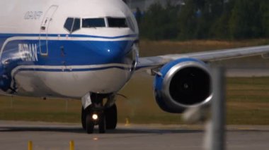 MOSCOW, RUSSIAN FEDERATION - JULY 29, 2021: Transport aircraft Boeing 737 of ATRAN taxiing on the runway at Sheremetyevo airport. ATRAN Russian cargo airline