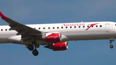FRANKFURT AM MAIN, GERMANY - JULY 18, 2017: Embraer E195LR, OE-LWP Austrian Airlines landing at Frankfurt airport, side view. Civil aircraft arrival