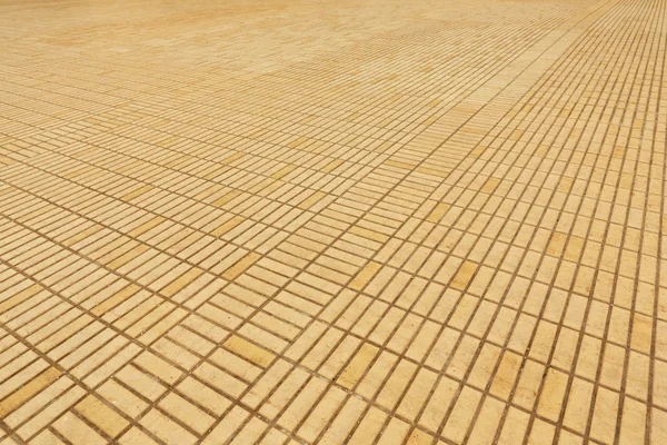 Pavimento de tijolo amarelo — Fotografia de Stock