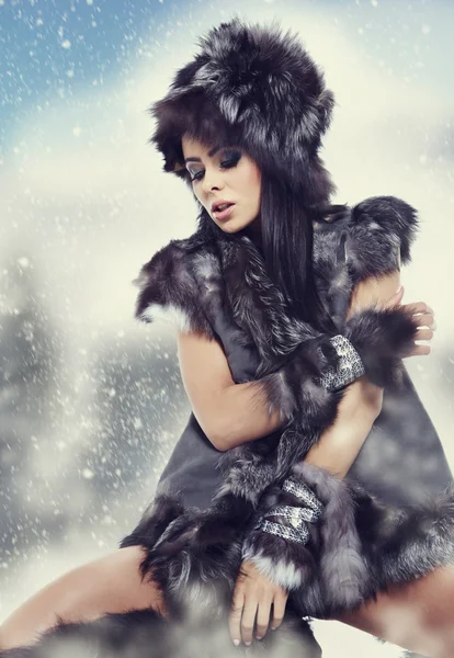 Winter wild woman on snow Stock Image
