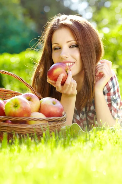 Beautiful woman in the garden with apples Royalty Free Stock Images