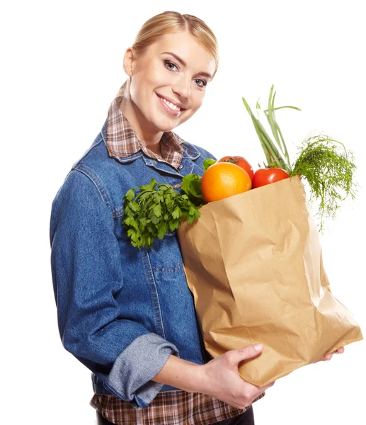 Vrouw met een zakhoogtepunt van gezond voedsel. winkelen . — Stockfoto