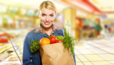 Woman buying some vegetables clipart