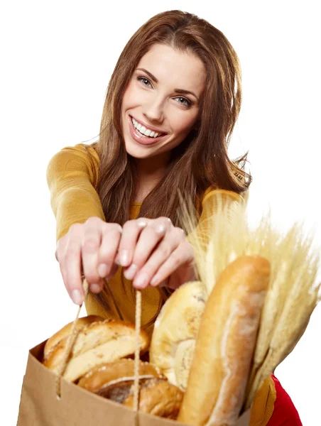 Portrait of smiling young woman holding a shopping bag full of g — Stock Photo, Image