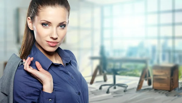 A portrait of a young business woman in an office — Stock Photo, Image