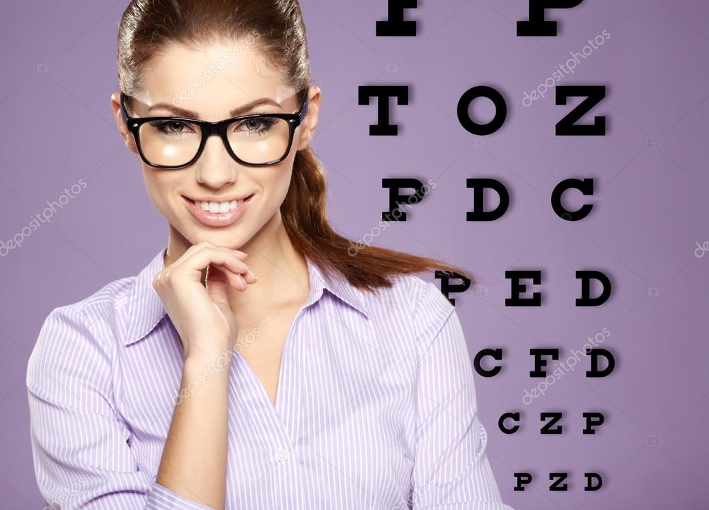 beautiful woman with trendy glasses on the background of eye te