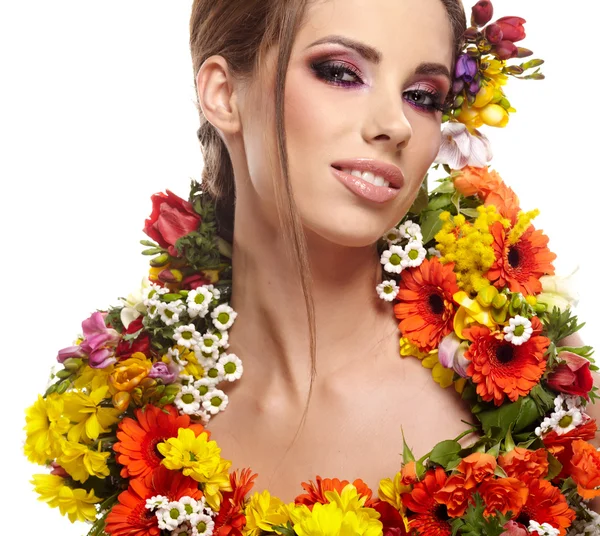 Portrait of a woman dressed in spring flowers — Stock Photo, Image