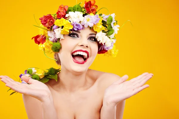 The attractive girl, front portrait, on a head a flower wreath — Stock Photo, Image