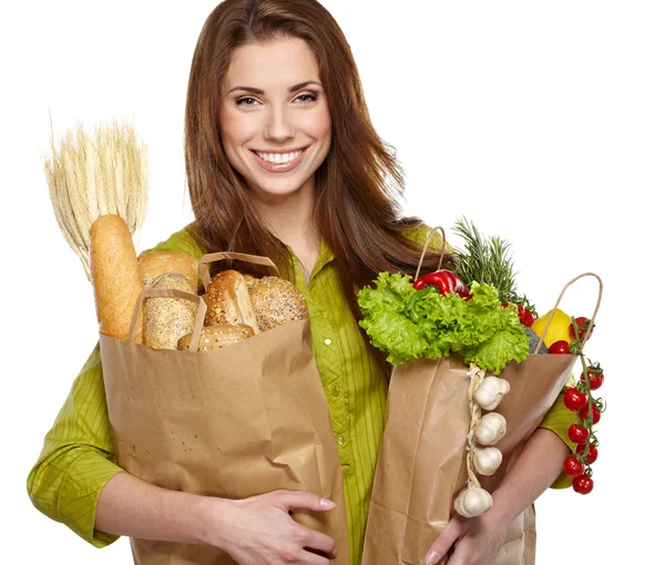 Ung kvinna med en livsmedelsaffär shopping väska. isolerad på vita backg — Stockfoto