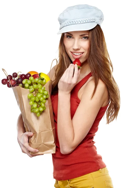 Young woman with a grocery shopping bag. Isolated on white backg — Stock Photo, Image