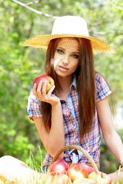 Beautiful woman in the garden with apples Stock Picture