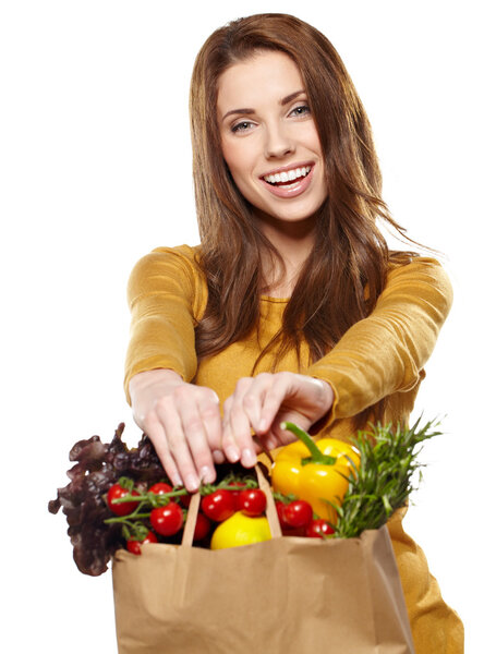 Young woman with a grocery shopping bag