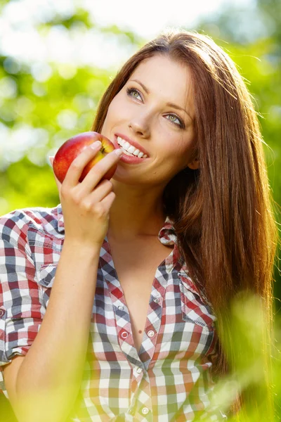 Portrait of beautifu young woman with a basket of fruit Royalty Free Stock Images