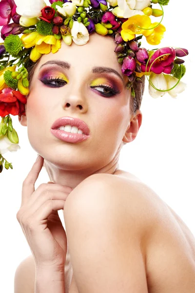 Mujer con peinado y flor de freesia. Aislado . — Foto de Stock