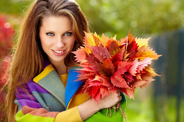 Autumn woman on leafs background — Stock Photo, Image